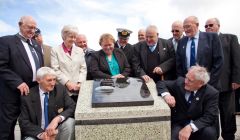 Recording the history of the whaling industry – members of the Shetland ex-Whalers Association, from left to right: Geordie Robertson, Davie Cooper, Gibbie Fraser (chairman), Laurena Fraser, Tony Jarmson, Pat Christie, Aubrey Jamieson (Fishermen’s Mission), Alister Thomasaon, Mitchell Arthur, Jamie Smith, Willie Tait, Billy Craigie and John Winchester (vice-chairman) – Photo: Shetland News