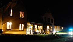 Fire crews examine the smoke damaged porch at Hillswick's St Magnus Bay Hotel on Friday night.