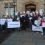 West side parents hand in a 1,048 signature petition to local member Theo Smith and council leader Gary Robinson ahead of Thursday's meeting. Pic. Shetland News