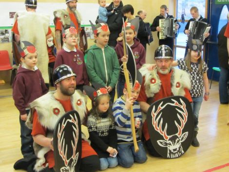 Jarl squad members John Manson and Scott Hatrick with South Nesting primary school bairns. Photo. Jennie Bradley