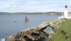 The Swan and the Pilot Us passing Bressay Lighthouse.