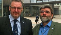 Flying the Shetland flag in Brussels are SIC political leader Gary Robinson (left) and Lerwick councillor Jonathan Wills - Photo: SIC