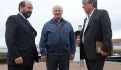 NYDC's Colin Dickie (left) and Robert Henderson show their delight with their grid connection upon meeting SSE chief executive Ian Marchant on Tuesday afternoon. Photo Shetland News
