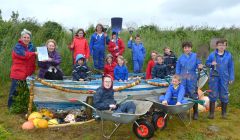 Celebrating success are (left to right back row) : Anna Perry, Amanda MacKay, Jolene Mackay, James Rendall; in the boat (left to right): Shaun Hoseason, Connor Fraser, Sophiea Down, Judy Hamer, Lily Rendall, David Bradley; front (left to right): Ewan Hutcheson, Morgan Fraser, Luke Malcolmson and Benjamin Hamer - Photo: Malcolm Younger/Millgaet Media