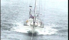 The yacht Exodus being towed into Scalloway harbour by the Aith lifeboat. Photo RNLI