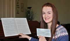 Teeanger Sophie Wishart with the prize she won for her outstanding exam result.