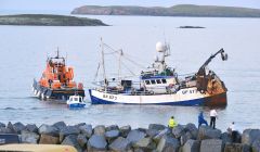Prospect being towed by the Lerwick lifeboat shortly before she sank on 5 August last year. Photo Malcolm Younger