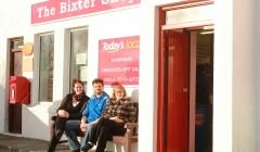 Kirsten and Steven Johnston, along with Steven's mother Margaret, take a well-earned breather outside the newly reopened Bixter Shop. Photo: Hans Marter/Shetnews.