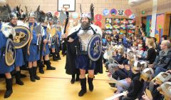 Brae Guizer Jarl Peter Peterson wows the bairns at Lunnasting primary at the start of a long and busy day and night. Photo Kevin Osborn