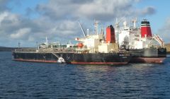 The British Tranquility transfers her cargo to the Island Express. Photo: John Bateson