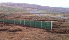 Northmavine's new snow fence ready to catch any last minute snow. Photo Shetnews