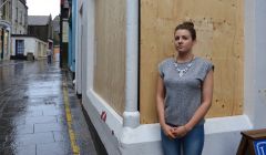 Chantelle Mockford outside her boarded up shop. Photo Shetnews/Neil Riddell