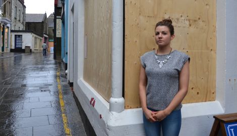 Chantelle Mockford outside her boarded up shop. Photo Shetnews/Neil Riddell