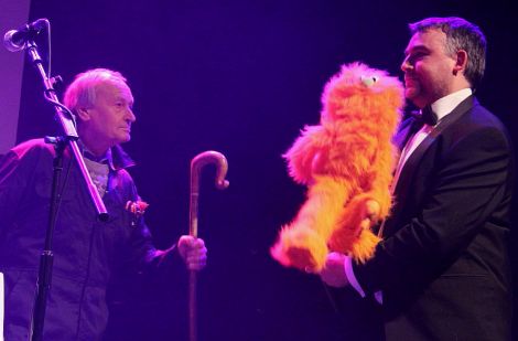 Shetland Arts director Gwilym Gibbons is chased off-stage by councillor Allison (Flea) Duncan. 