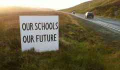 One of many signs that have sprung up across the isles in protest at the council's school closure plans.