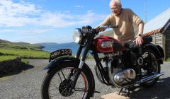 Jackie Edwardson with his old BSA A7 outside his Heylor home. Photo Shetnews