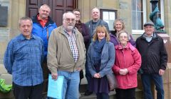Parents and carers, pictured following the meeting, are "very pleased" that a new care centre will be built. Photo: Shetnews