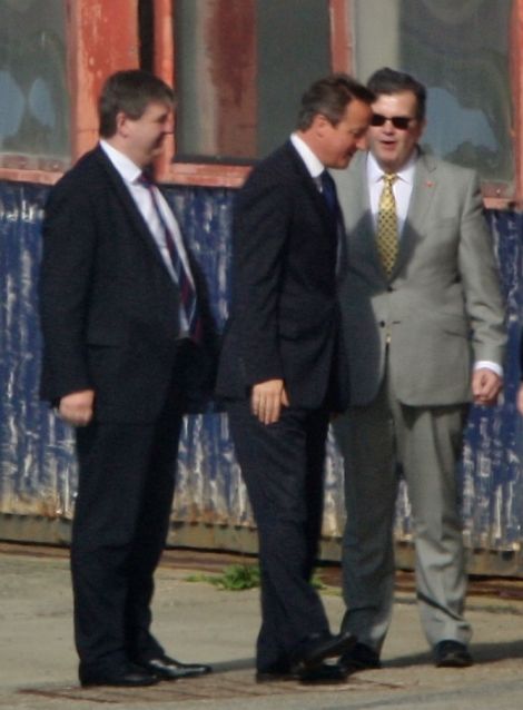 One of the first photos of David Cameron in Shetland taken shortly after his arrival at Sumburgh airport in the afternoon of 22 July. With him is Alistair Carmichael, the Scottish secretary and local MP - Photo: Ronnie Robertson