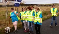 Liz Peterson out on the walk, along with her Jack Russell and friends, on Sunday. Photo: Barry Broadbent