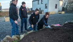 Filling in the planters are (from left) local neighbour Frank Johnson, Luke Smith, Stewart Hornal and Holly King - Photo: Austin Taylor.