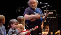 Brian Nicholson leads a group of ukulele-wielding youngsters on Saturday night. Photo: Chris Brown