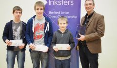 Sponsor Brian Inkster with the joint Shetland Junior Chess Champions for 2014 – Duncan Burgess, Leon Riise and Luke Riise.