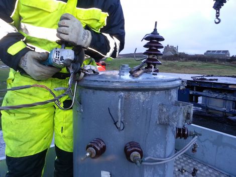 An SSE engineer preparing the transformer to be transported away after it had been hit by lightning in the early hours of Saturday.