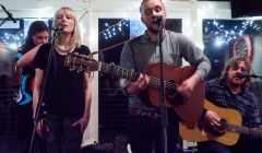 Yorkshire-bred singer songwriter Adam Guest, flanked by Louise Thomason and Arthur Nicholson, during his EP launch at Lerwick Boating Club. In the background is fiddle player Catherine Brown. Photo: Chris Brown