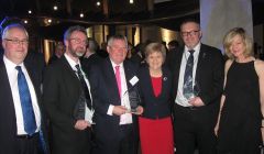 First Minister Nicola Sturgeon congratulates the OIOF leaders on their award. From left to right: Malcolm Burr (Western Isles), Steven Heddle (Orkney), Angus Campbell (Western Isles), SIC leader Gary Robinson and Gillian Morrison (Orkney).