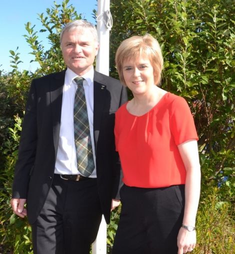 First Minister Nicola Sturgeon, pictured with MSP Mike Mackenzie in Shetland last summer, feels government attempts to tackle welfare problems and unemployment will remain hampered. Photo: Shetnews/Neil Riddell