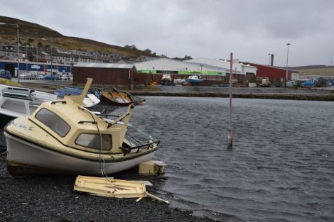Damage to a boat tied up across the road from Bolts. Photo: Shetnews