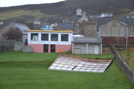 The roof of the old pavilion at Scalloway's Fraser Park has taken up residence on the football pitch. Photo: Shetnews