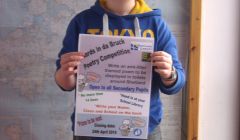 Alec Henry, a member of the Anderson High School Pupil Council, with the poster he designed for the competition.
