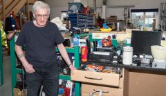 Brian Priest on his last day with COPE. "y repairing days are over, but there's still a curiosity about why something doesn't work." Photo Austin Taylor