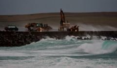 Last December emergency services had to rescue a trapped digger driver who was carrying out repair work on the runway. Photo: Ronnie Robertson