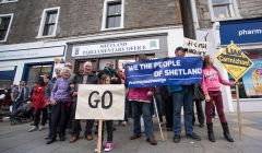 Protesters outside Alistair Carmichael's constituency office last Saturday. The protest is to be repeated this Saturday at 2pm.