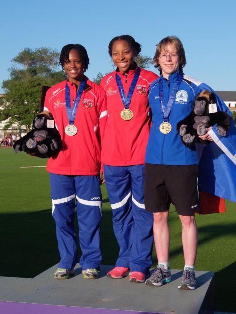 Unst runner Faye Cox with the gold and silver medallists Taahira Butterfield and Natasha Trott, both from Bermuda - Photo: SIGA 