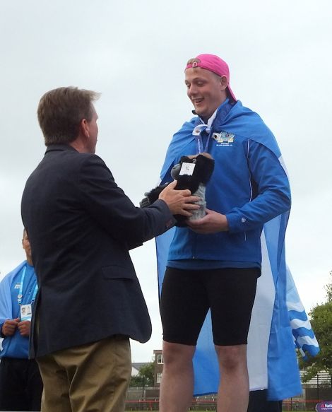 Maurice Williamson receiving the bronze medal in the hammer throw - Photo: Maurice Staples