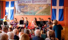 The Scandi Sessions fiddlers, a group put together by tutors Eunice Henderson and Debbie Scott, on stage at Islesburgh on Monday night. Photo: Dale Smith