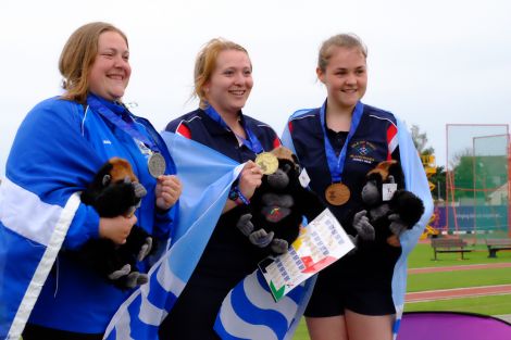 A proud moment for Elaine Park (left) as she receives her silver medal for the hammer throw. Photo courtesy of Shetland Island Games Association