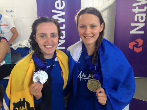 The unstoppable Andrea Strachan (right) with her third gold medal of the games after winning Thursday's 100m individual medley. She is pictured with silver medal winner Kara Hanlon. Photo: Shetland Island Games Association
