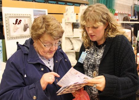 Designer Julie Williamson with a customer.
