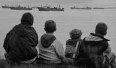 Kids in Lerwick watch the klondykers from the safety of the banks. Photo Jeremy Sutton-Hibbert