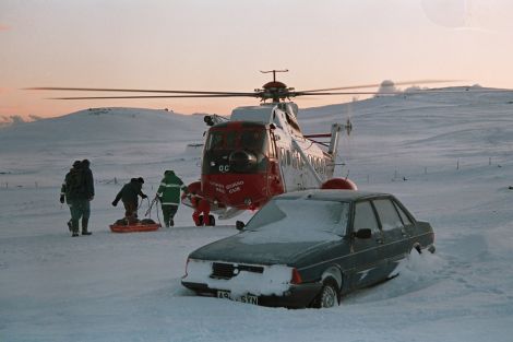 The same patient is about to be loaded on the helicopter for transfer to the Clickimin landing site, which at that time was on the north football pitch behind the goals.