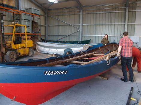 Some of the boats being moved into place at the new store and workshop.