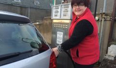 Hillswick Shop manageress Sheila Tulloch filling up while fuel is cheap. Photo ShetNews