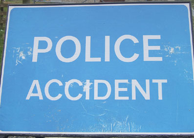 A blue and white police accident sign.