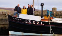 The Shetland Boat Week organising team on board the Pilot Us (left to right): Brian Wishart, Emma Miller, John Henderson of main sponsor Ocean Kinetics, and Dr Ian Tait of Shetland Museum and Archives.