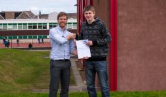 Dean Guthrie (right) receiving JLO Engineering's first ever scholarship from Joe Leask.