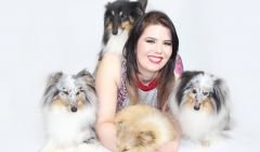 Lerwick woman Kaylee Robertson with her four sheepdogs.